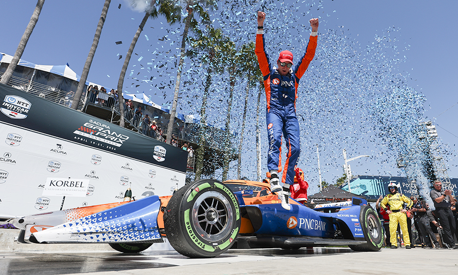 Scott Dixon Celebrates on top of his Chip Ganassi Race Car